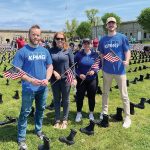 KPMG LLP REMEMBERING VETERANS: KPMG LLP employees help set up the “Boots on the Ground” display with Wounded Warriors at Fort Adams State Park in Newport.
COURTESY KPMG LLP