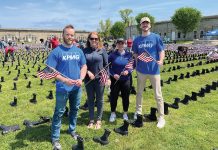 KPMG LLP REMEMBERING VETERANS: KPMG LLP employees help set up the “Boots on the Ground” display with Wounded Warriors at Fort Adams State Park in Newport.
COURTESY KPMG LLP