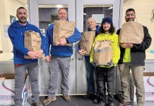 IN THE BAG: Lockheed Architectural Solutions Inc. holds bags of groceries and supplies for those in need.  COURTESY LOCKHEED ARCHITECTURAL SOLUTIONS INC.