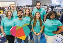 Amica Mutual Insurance Co. WARM FEELING: Amica Mutual Insurance Co. employees gather around donated clothes to distribute them to those in need.
COURTESY AMICA MUTUAL INSURANCE CO.