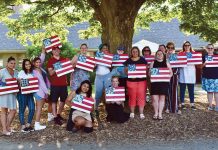 Marasco & Nesselbush LLP FLAG DAY: Marasco & Nesselbush LLP employees hold up U.S. flag paintings they made during an employee-led paint day.
COURTESY MARASCO & NESSELBUSH LLP