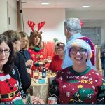 CHRISTMAS SPIRIT: Partridge Snow & Hahn LLP staffers don festive attire at the law firm’s annual holiday party.  COURTESY PARTRIDGE SNOW & HAHN LLP
