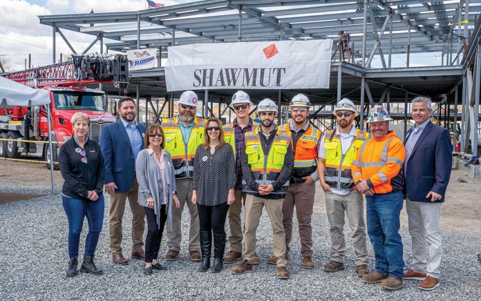 REACHING THE TOP: Shawmut Design and Construction employees celebrate a topping off at Elizabeth Baldwin Elementary School in Pawtucket.  COURTESY SHAWMUT DESIGN AND CONSTRUCTION
