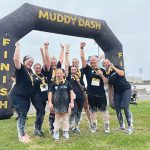 South County Smiles DASH TO THE FINISH: South County Smiles staffers celebrate at the finish line of the 2024 Muddy Dash Race.
COURTESY SOUTH COUNTY SMILES