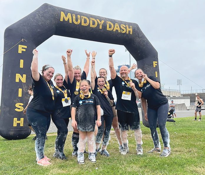DASH TO THE FINISH: South County Smiles staffers celebrate at the finish line of the 2024 Muddy Dash Race.
COURTESY SOUTH COUNTY SMILES DASH TO THE FINISH: South County Smiles staffers celebrate at the finish line of the 2024 Muddy Dash Race.
COURTESY SOUTH COUNTY SMILES