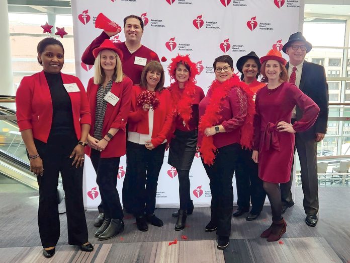 SEEING RED: The Beacon Mutual Insurance Co. employees celebrate at a recent American
Heart Association Go Red for Women event.
COURTESY THE BEACON MUTUAL INSURANCE CO. SEEING RED: The Beacon Mutual Insurance Co. employees celebrate at a recent American
Heart Association Go Red for Women event.
COURTESY THE BEACON MUTUAL INSURANCE CO.