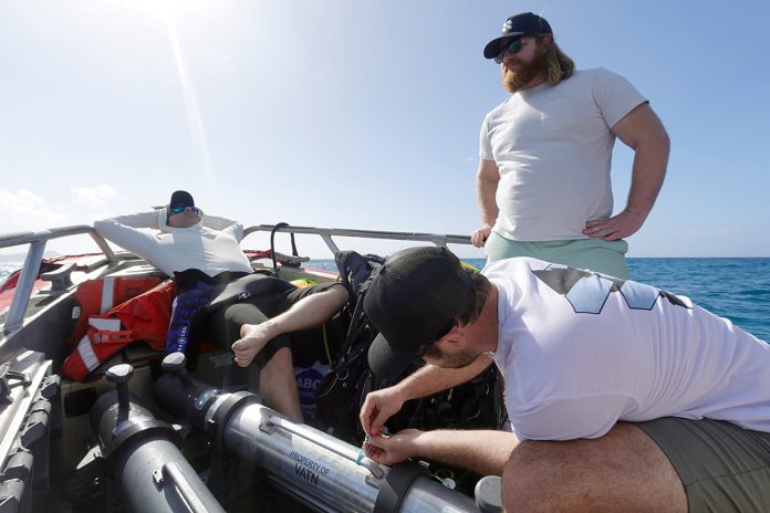 ON THE WATER: Vatn Systems Inc. employees relaxing on a boat.  COURTESY VATN SYSTEMS INC.