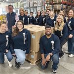 FOOD FOR THOUGHT: BankNewport team members volunteer at the Rhode Island Community Food Bank, assembling meal boxes for seniors.  COURTESY BANKNEWPORT