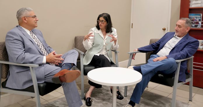 STRATEGY SESSION: Nina Pande, center, executive director of Skills for Rhode Island’s Future, discusses workforce development with East Providence Mayor Roberto DaSilva, left, and Woonsocket Mayor Christopher Beauchamp.  COURTESY CHELSEA DECESARE