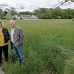FORGING AHEAD: East Bay Community Development Corp. Executive Director Diane Mederos, left, and consultant Frank Spinella stand at the future site for Penny Lane, a 40-unit affordable housing project planned along Child Street in Warren. Neighbors opposed the plans, but it eventually gained approval in part because the town’s ratio of affordable housing is too low.  PBN PHOTO/MICHAEL SALERNO