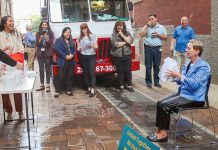SPLASH DOWN: R.I. Housing and Mortgage Finance Corp. staff doused CEO and Executive Director Carol Ventura with water to help raise more than $1,000 in donations for the ALS United RI.  COURTESY R.I. HOUSING AND MORTGAGE FINANCE CORP. 