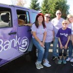 MARCHING ALONG: Fall River Five Cents Savings Bank employees gather before a recent parade in Somerset.  COURTESY FALL RIVER FIVE CENTS SAVINGS BANK