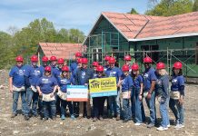 The Washington Trust Co. HOME IMPROVEMENT: The Washington Trust Co. employees help construct a house as part of a project by South County Habitat For Humanity.
COURTESY THE WASHINGTON TRUST CO.