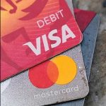 CHANGE COMING? Visa Inc.. and Mastercard Inc. dominate credit card payment processing, but a bill in Congress is aiming to change that with the hope of reducing fees for merchants.  AP FILE PHOTO/STEVE HELBER