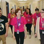 ON THE MOVE: Some of the newest members of the Rhode Island Federation of Teachers and Health Professionals make their way through the halls of the charter school Paul Cuffee School in Providence. They include, in front from left, Robert Capellan, third grade teacher; Sara Lefrancois-Vickey, fifth grade teaching partner; and Hannah Baker, kindergarten teacher. In the next row, from left, is Allison Merrill, first grade teacher; Andrea Lahlum, second grade teacher; and Noah Provost, second grade teacher. In the back is Stacy Gale, fourth grade teacher, and blocked from view is Jennifer Bifulco, third grade teacher. PBN PHOTO/ELIZABETH GRAHAM