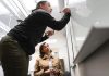 ALL IN: Dawn Apajee, right, owner and founder of professional staffing service City Personnel Inc., says the company is not pulling back on its commitment to diversity, equity and inclusion. Writing on the board above is Recruiting Coordinator Adora Andrade. PBN FILE PHOTO/­MICHAEL SALERNO