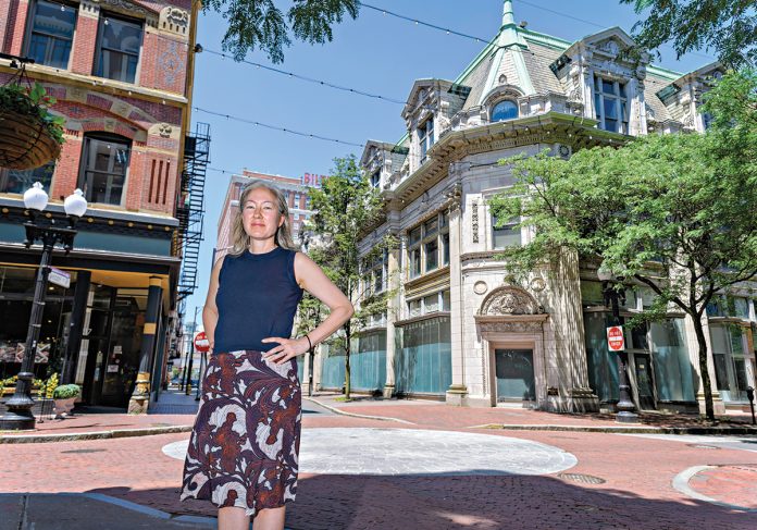 A WELCOME DEVELOPMENT: Marisa Angell Brown, Providence Preservation Society executive director, is eagerly awaiting the redevelopment of the former Providence Journal headquarters at Westminster and Eddy streets in downtown Providence. The building has been mostly vacant for more than a decade.  PBN PHOTO/MICHAEL SALERNO