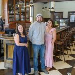 NEW MARKET: Lydia Emmons, left, managing partner, is joined by co-owners Daniel and Charle Hornby at Sawyer’s Market on Broadway in Providence, which opened in June. PBN PHOTO/MICHAEL SALERNO