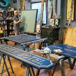 LEAVING HIS MARK: Providence Painted Signs owner Shawn Gilheeny works in his Marvin Street studio. His signature work can be seen throughout the capital city and beyond.  PBN PHOTO/MICHAEL SALERNO