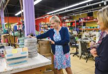 PRODUCT ASSESSMENT: Alice Nichols, left, founder and owner, and Donna Bodell, vice president and designer, look over some of the products on the factory floor at pet supply manufacturer Up Country in East Providence. PBN PHOTO/MICHAEL SALERNO