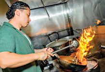 HOT SPOT: Chef Subat Dilmurat, owner of Jahunger LLC, a Uyghur restaurant in Providence, prepares one of his signature dishes, Jahunger Noodles.  PBN PHOTO/MICHAEL SALERNO