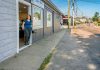 HIDDEN HAZARD: Claudia Conley, owner of Claudia’s Furry Tailz Pet Spa LLC, stands in the doorway at the spa on Market Street on a dry summer day. She says she lost two days of business last winter because of flooding. PBN PHOTO/MICHAEL SALERNO
