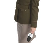 the prop Alexandra Curtis holds a camera and microphone with the R.I. National Guard logo, representing the many capabilities of public affairs soldiers.