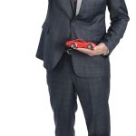 William Maxwell Daley the propS William Maxwell Daley stands with a copy of Ron Chernow’s “Hamilton” book; a toy Porsche 911; a painting of his dog, Sophia, 8; and a Fédération Internationale de Volleyball game ball from when he competed in professional volleyball after college.