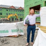 UNDER CONSTRUCTION: Taction Properties principal developer Derek Mesolella visits the site of a mixed-use development on West Main Road in Middletown that has been in the works for more than five years, but he hopes that recently approved legislation modifying the state building code will help to reduce the red tape associated with housing production in Rhode Island.  PBN PHOTO/DAVID HANSEN