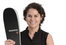the prop Lizzy Desibia holds skis, which is her favorite activity. “It reminds me to lean into challenges, stay present and find momentum even on steep terrain,” she said.