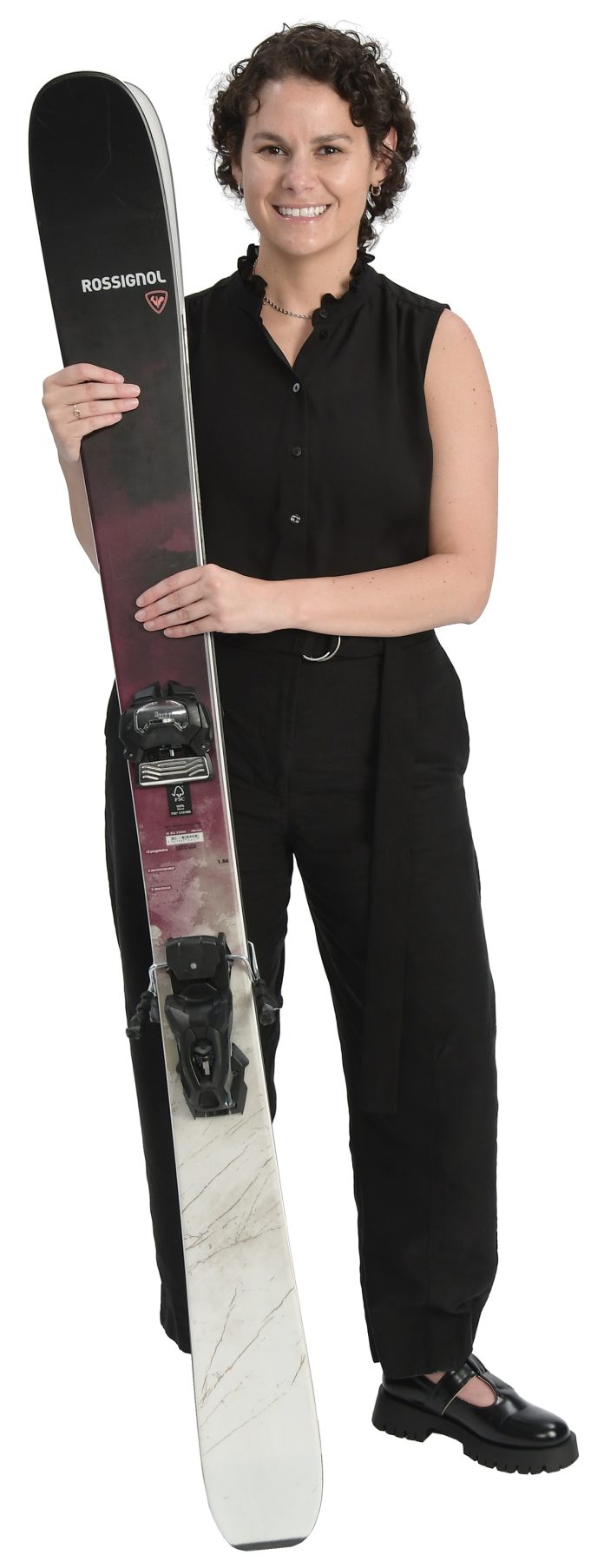 the prop Lizzy Desibia holds skis, which is her favorite activity. “It reminds me to lean into challenges, stay present and find momentum even on steep terrain,” she said.