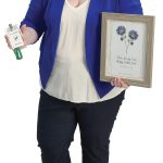 Katherine Fish the propS Katherine Fish holds her Washington County Fair committee badge and a day of remembrance photo from Bridget’s Cradles in
honor of her twins, Ethan Harrop
and Hayley Cullen Fish.