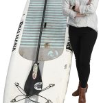 Carrie Gill the prop Carrie Gill poses with a paddleboard, symbolizing her love for being on the water.