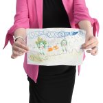 the prop Meghan L. Hopkins holds a picture that her daughter drew of her that Hopkins keeps in her office.