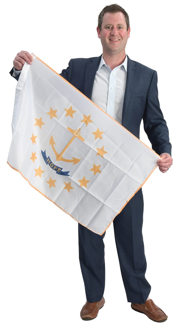 the prop Eric Lichatin holds the Rhode Island state flag, defining where he’s from and who he is. the prop Eric Lichatin holds the Rhode Island state flag, defining where he’s from and who he is.