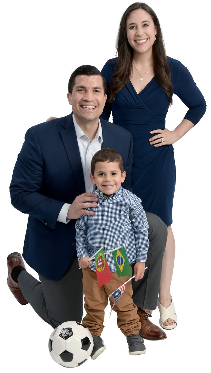 the prop Daniel Lima poses with his wife, Julianne, and their son, Benjamin, 3, as well as with a soccer ball and the Portuguese, Brazilian and U.S. flags. the prop Daniel Lima poses with his wife, Julianne, and their son, Benjamin, 3, as well as with a soccer ball and the Portuguese, Brazilian and U.S. flags.