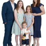 the propS Arthur Lopez poses with his wife, Heidi; daughters Kylie, 12, and Sophie, 10; and son, Caden, 2; and samples of Autocrat Coffee Syrup and tea products made at Finlay Extracts & Ingredients USA Inc.