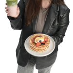 Andreea Marin the prop Andreea Marin holds a branded cup and a dish on Kaffeology’s menu. “I want to bring our coffee because that is where it all started, a coffee shop in Newport,” she said.