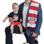 Michael J. Medeiros the prop Michael J. Medeiros poses with his son, Joseph, along with a couple soccer balls and a U.S. Soccer scarf.