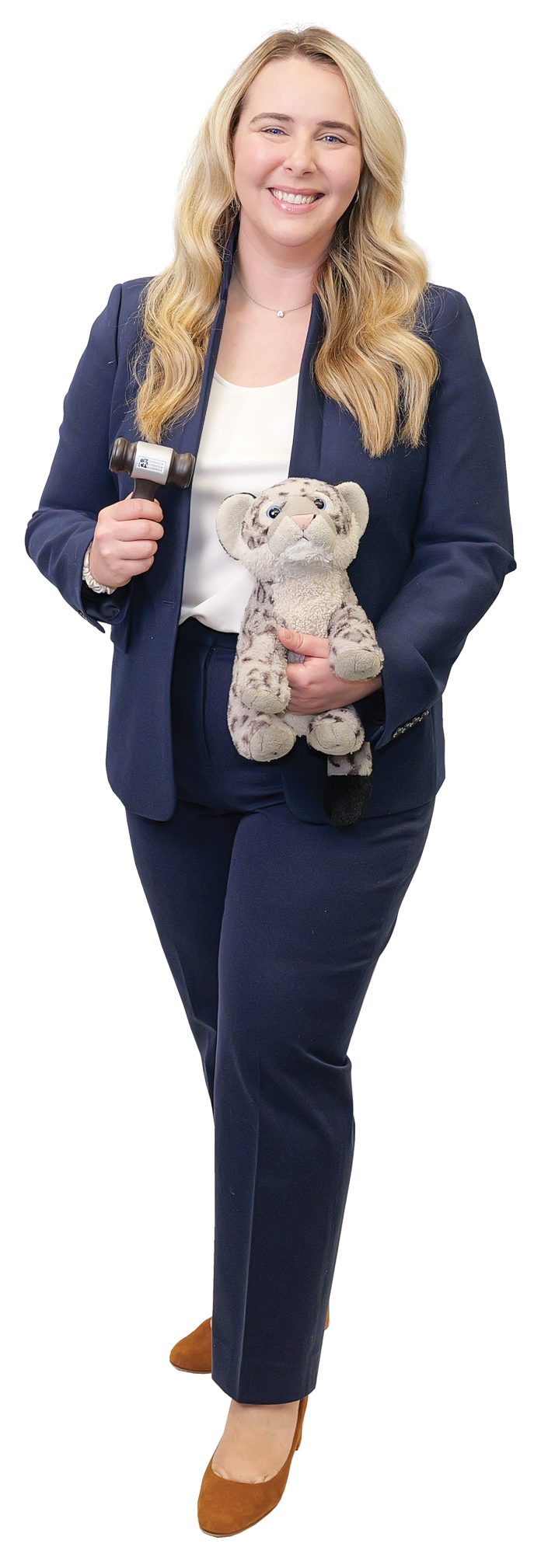 the prop Lindy Nash holds a gavel and her son’s favorite stuffed animal, “Snow Leopard.” the prop Lindy Nash holds a gavel and her son’s favorite stuffed animal, “Snow Leopard.”