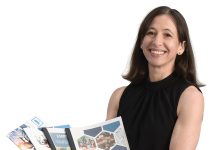 the prop Justine Oliva holds several recent Rhode Island Public Expenditure Council reports.  “We dig deep into issues, share our findings  and use them to develop practical public policy reforms,”  she said.