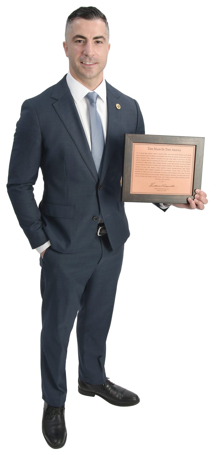 the prop Andrew Rebello holds a plaque engraved with Theodore Roosevelt’s “Man in the Arena” quote. “It’s a reminder that actual impact comes not from watching safely from the sidelines but from stepping into the arena, facing challenges, taking risks and daring greatly with heart and conviction,” Rebello said. the prop Andrew Rebello holds a plaque engraved with Theodore Roosevelt’s “Man in the Arena” quote. “It’s a reminder that actual impact comes not from watching safely from the sidelines but from stepping into the arena, facing challenges, taking risks and daring greatly with heart and conviction,” Rebello said.