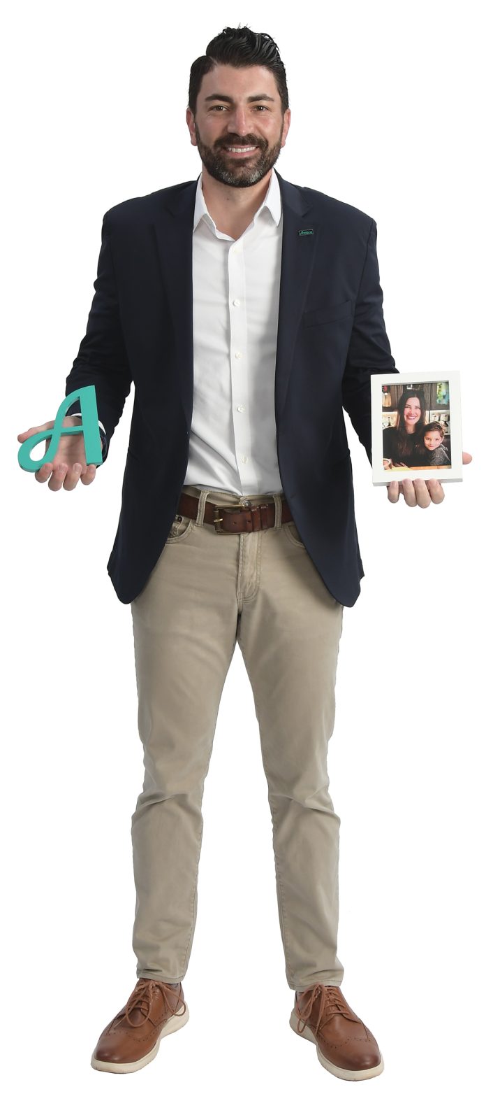 the prop M. Evan Sherer holds the Amica “A” and a family photo.