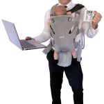 the prop Robert Ellsworth holds a laptop, a dad mug and his infant daughter. “Just a typical day as a remote working dad!” he said. 