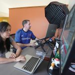 Being a millionaire ain’t what it used to be RICH ON PAPER: Daravy Khiev, left, and Jason Breck work in their home in Fishers, Ind. The couple reached the $1 million mark in net worth nine years ago.
AP PHOTO/DARRON CUMMINGS