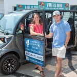 Cruising through Newport SEASIDE RIDES: Rebecca and Braedan Campbell, owners of Coastal Cruisers in Newport, are pictured with one of their all-electric shuttles.
PBN PHOTO/DAVID HANSEN