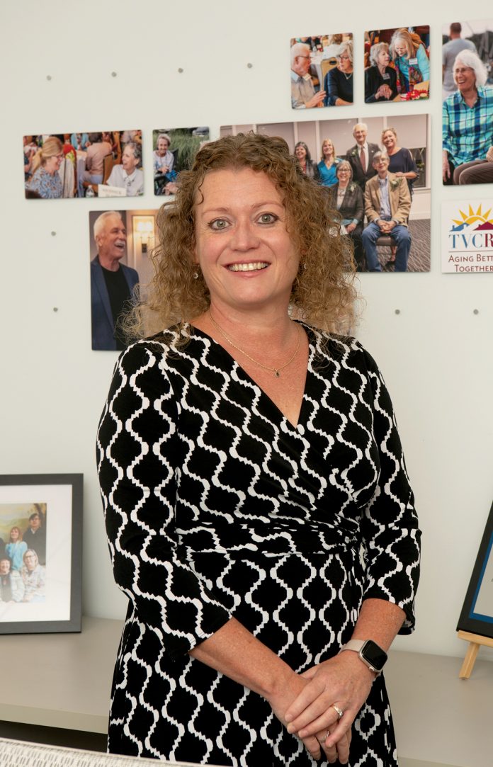 TAKES A VILLAGE: Caroline Dillon, executive director for The Village Common of Rhode Island, directs day-to-day operations, including hiring and guiding staff. Since she came on board, she has grown the number of villages from four to 10 and volunteers have more than tripled.  PBN PHOTO/JOSH EDENBAUM