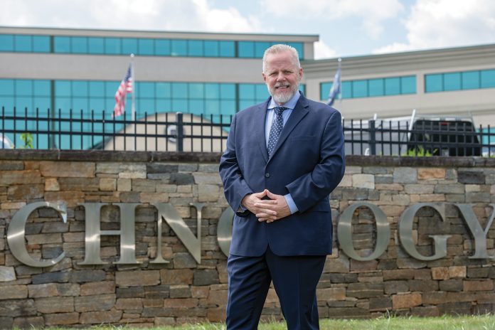 CAREER SHIFT: Henry “Hank” Johnson, New England Institute of Technology’s business management department chair, pivoted from working in financial services to becoming an educator following a back injury in 2006.  PBN PHOTO/JOSH EDENBAUM