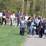 FOR A STROLL: Point32Health Co. employees take part in the company’s Walk and Roll with Leaders outdoor walking initiative. COURTESY POINT32HEALTH CO.