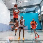 HOOP DREAMS: U-Haul International Inc. employees participate in a basketball game at a company recreation facility. COURTESY U-HAUL ­INTERNATIONAL INC.